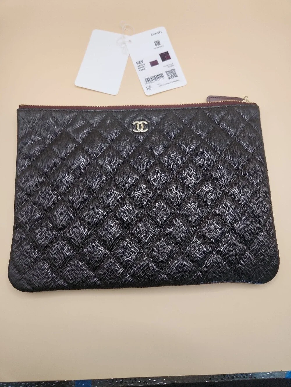 CHANEL Black Quilted Caviar Leather Pouch with Gold CC
